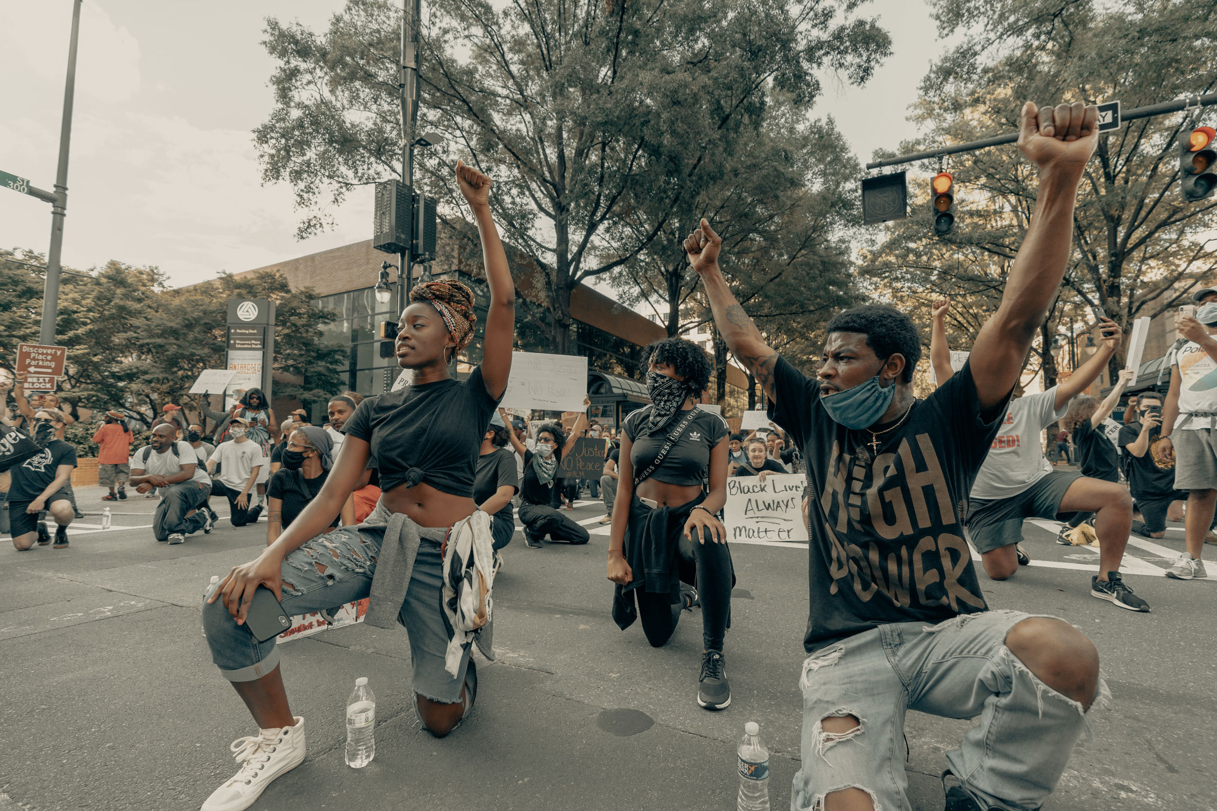 People raising their fists at a Black Lives Matter protest